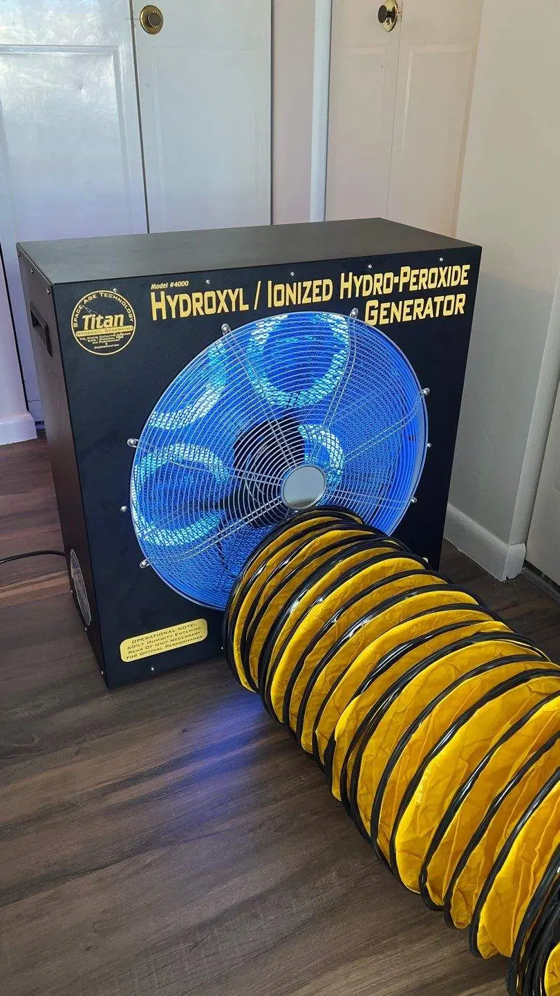 FixMold indoor mold cleanup setup with ventilation hoses and protective coverings