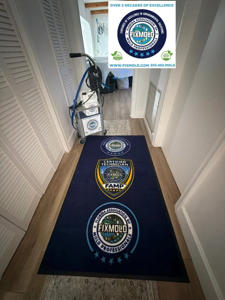 Collection of FixMold mold remediation tools including meters hoses and protective gear on work surface